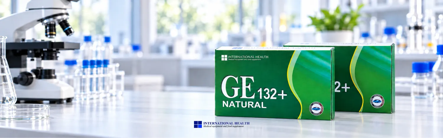 Laboratory setting with a microscope and bottles in focus. Two boxes labeled "GE 132+ Natural" are in the foreground.
